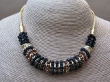 Three Piece Necklace Earring and Bracelet Set Encrusted with Multi Coloured Beaded Loop Rings