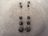 Long Black Faceted Acrylic Crystal Bead Earrings in a Gold Tone Setting