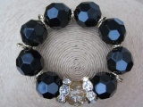 Jet Facet Bead Stretch Bracelet with Rhinestone Loops and Speckled Gold Tone Centre Bauble