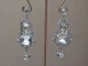 Clear Crystal Cut Earrings in a Woven Silver Tone Surround